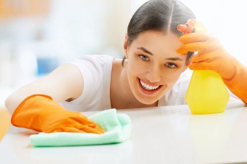 Commercial cleaning team sanitizing high-touch surfaces